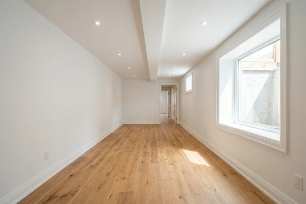After: the same basement finished as a legal unit