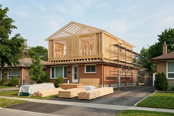 Bungalow with a framed second-storey addition under construction