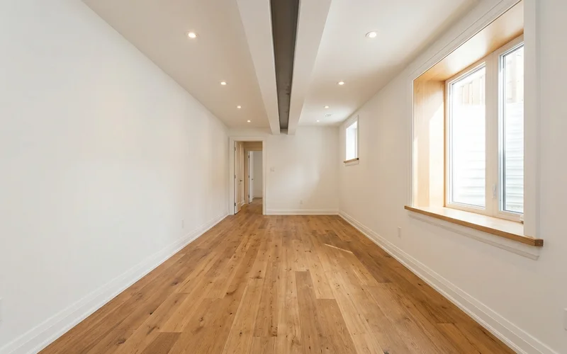 The same basement finished as a legal unit with full ceiling height